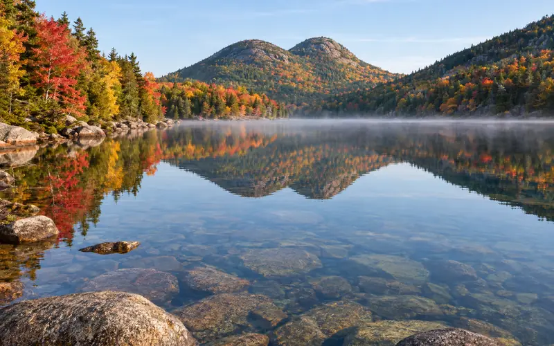 Jordan Pond reflecting The Bubbles in autumn