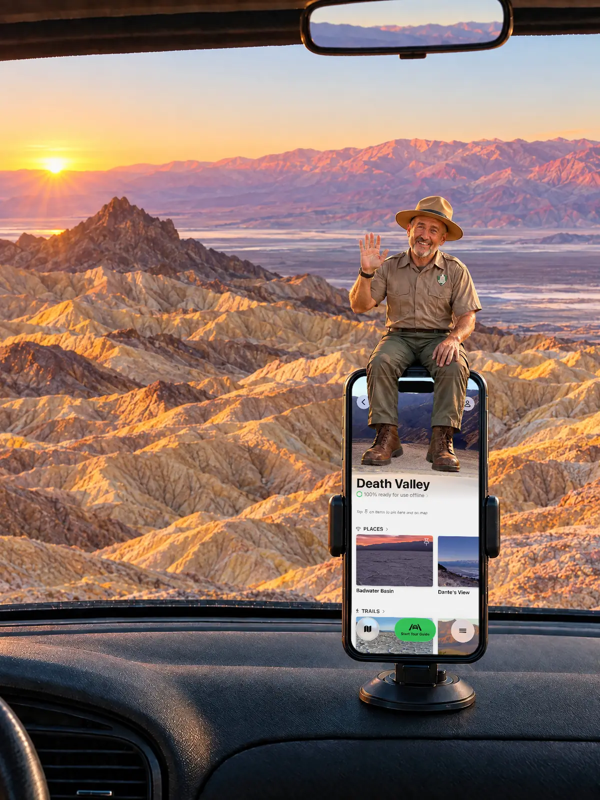 The Parkwolf tour guide waving from a dashboard phone at sunrise over the Zabriskie Point badlands