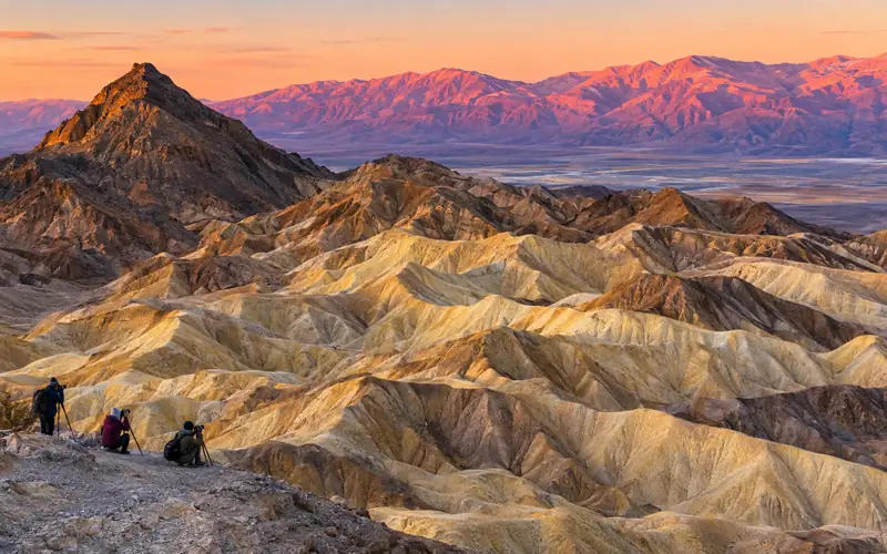 Golden badlands and Manly Beacon at Zabriskie Point at sunrise